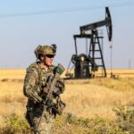 A US occupation soldier patrols near an oil well in al-Qahtaniyah in Syria's northeastern Hasakah province, June 14, 2023. Photo: AFP.