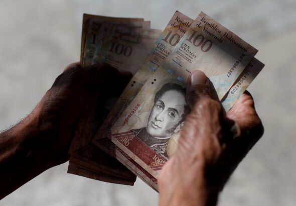 A handful of Venezuela bolívars. Photo: Reuters.