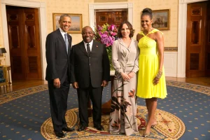 President Barack Obama and First Lady Michelle Obama with Ali Bongo Ondimba, President of Gabon in the Blue Room during a U.S.-Africa Leaders Summit dinner at the White House, Aug. 5, 2014. Photo: Wikimedia Commons.