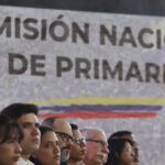 Participants in an event of the opposition's National Primary Commission, with a banner in the background carrying the name of the body. Photo: RedRadioVE/File photo.