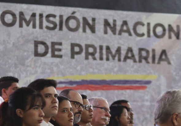 Participants in an event of the opposition's National Primary Commission, with a banner in the background carrying the name of the body. Photo: RedRadioVE/File photo.