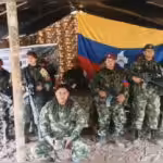 FARC dissidents guerrillas pose with a captured Colombian soldier seated in the middle, in a proof of life video released by the armed group in January 2023. Photo: YouTube/FARC-EP.