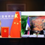 Photo composition of Chinese and Nicaraguan government representatives attending the signing of the free trade agreement between the two countries. Photo: Canal 2.