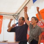 Marxist speakers raising their fist during their participation at the Fête de l’Humanité in Paris, France on September 2023. Photo: Platform News.