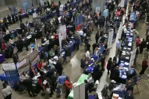 People visiting the booths of prospective employers during a job fair for US veterans at the Washington Convention Center. Photo: Mark Wilson/Getty Images.