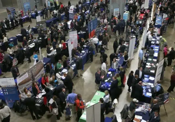 People visiting the booths of prospective employers during a job fair for US veterans at the Washington Convention Center. Photo: Mark Wilson/Getty Images.