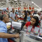 Person paying at a crowded grocery store in Venezuela. File photo.