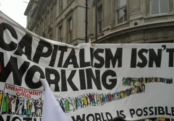 Banner that reads "Capitalism isn't Working." Photo: Flickr.