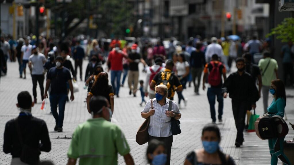People walking in a Caracas street. Photo: AP.