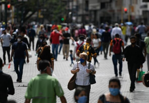 People walking in a Caracas street. Photo: AP.
