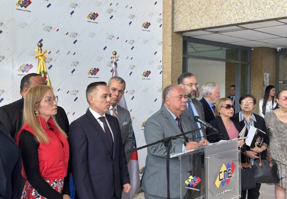 CNE President Elvis AMoroso speaking to the press after a meeting with opposition actors to discuss technical assistance for opposition primaries, with Head of the National Primaries Commission Jesús María Casal to his left. Photo: X/@osmarycnn.