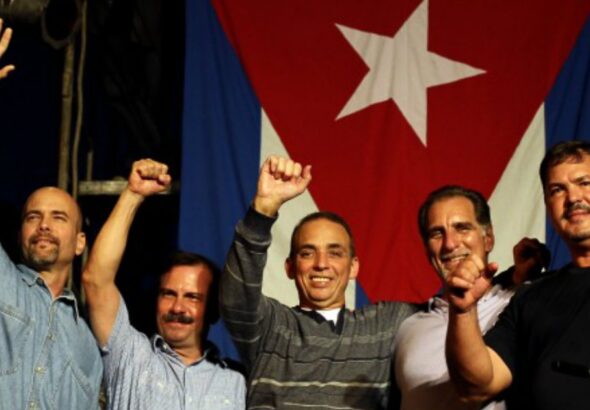 The Cuban Five, photographed in front of the Cuban flag. Photo: Resumen Latinoamericano-English/File photo.