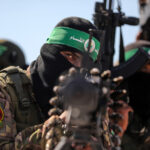 Palestinian fighters with the Qassam Brigades, the military wing of Hamas, pictured in Gaza in July. Photo: Majdi Fathi/APA.