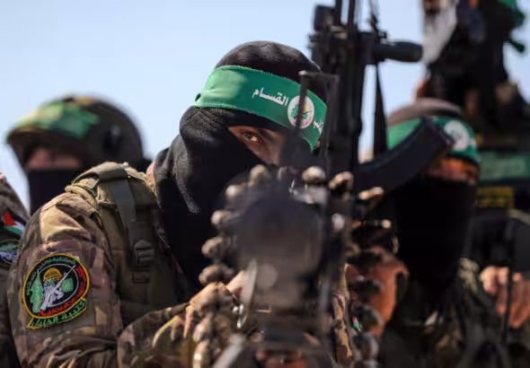 Palestinian fighters with the Qassam Brigades, the military wing of Hamas, pictured in Gaza in July. Photo: Majdi Fathi/APA.