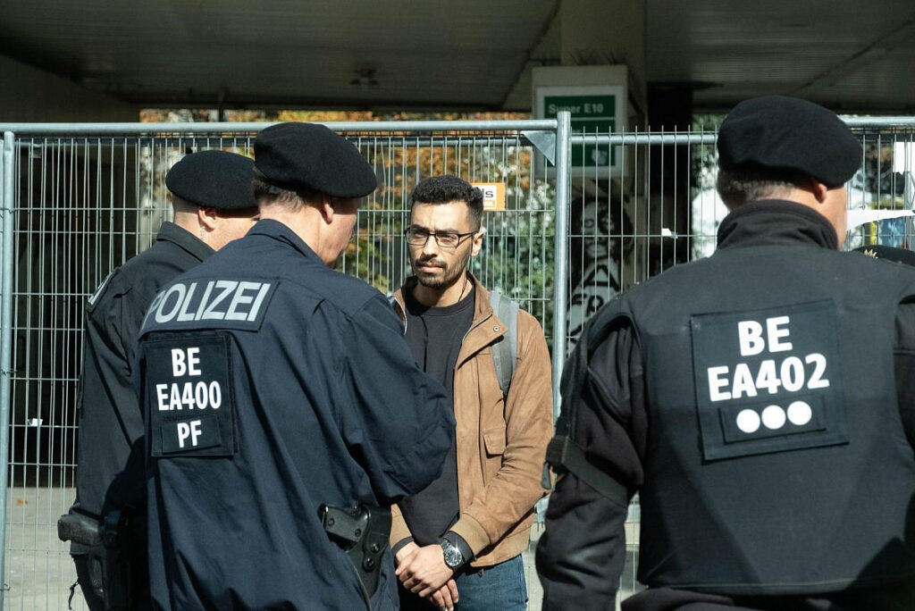 Zaid Abdulnasser, a Palestinian refugee from Syria living in Berlin, and activist with Samidoun, being accosted by German police on October 1, 2023. Photo: Samidoun.
