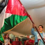 Venezuelan President Nicolas Maduro waving a Palestinian flag during a solidarity event. Photo: File photo.