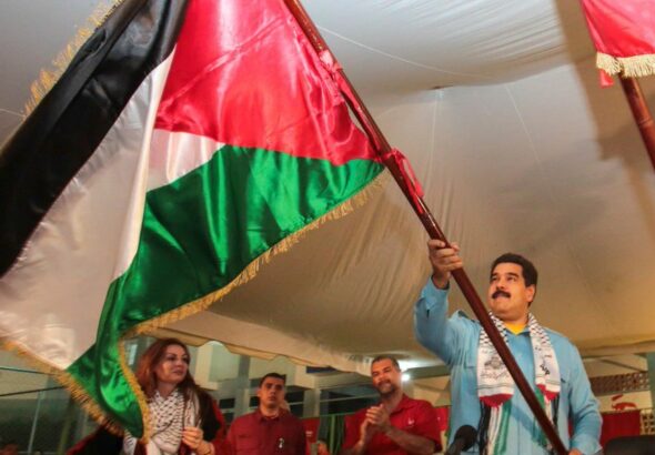 Venezuelan President Nicolas Maduro waving a Palestinian flag during a solidarity event. Photo: File photo.
