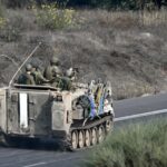 Israeli soldiers ride an armored vehicle along a road on the outskirts of the Gaza strip in occupied Palestine on October 28th. Photo: Aris Messinis/AFP.