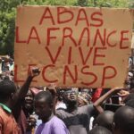 Protesters with sign that reads: Down with France, long live the CNSP (National Council for the Safeguard of the Homeland). Photo: Peoples Dispatch/file photo.