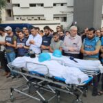 Journalists holding a funeral for their colleagues Mohammad Soboh and Saeed Al-Taweel, who were brutally killed after being targeted by an Israeli airstrike three nights ago while covering the evacuation of a building threatened by Israeli bombing west of Gaza City. Photo: Mahmoud Ajjour/The Palestine Chronicle.