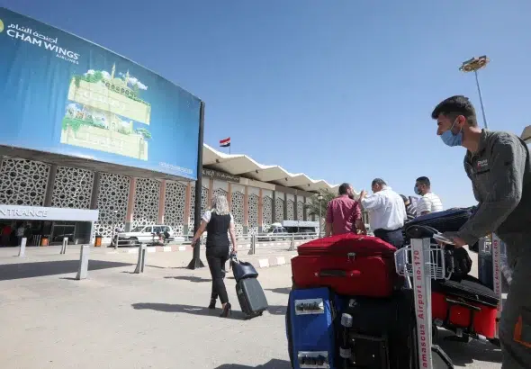 Passengers wearing protective face masks arrive at the Damascus International Airport, on the outskirts of Syria’s capital, October 1, 2020. Photo: Louai Beshara/AFP/Getty Images/File photo.
