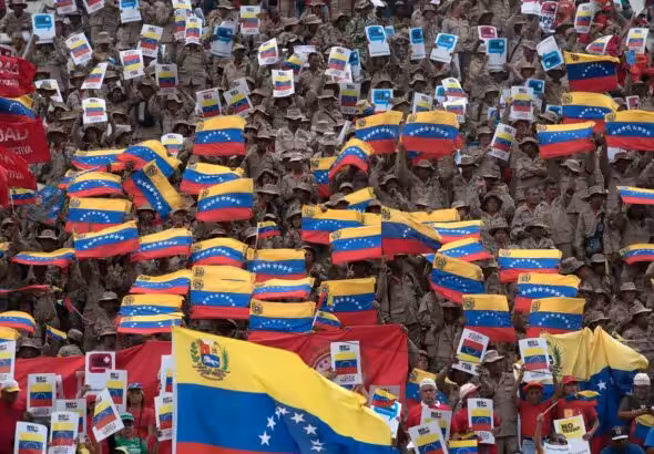Crowds of the Venezuelan military waving national flags. Photo: Sputnik.