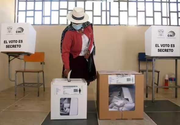 A person casts their vote during the 2021 Presidential Elections in Cuenca, Ecuador. Photo: Cristina Vega Rhor/AFP/Getty Images/File photo.