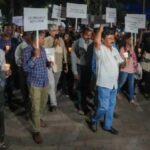 Journalists take part in a candle march against Police raid on news portal NewsClick, in Mumbai on Thursday. Photo: PTI.