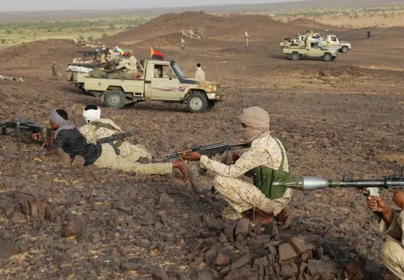 Tuareg fighters next to pickup trucks equipped with machine guns near Kidal, northern Mali, on September 28, 2016. Photo: AFP/File photo.
