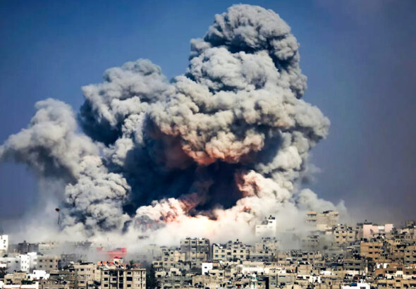 Smoke and fire engulf Gaza City following an Israeli airstrike on the densely populated urban area. Photo: Hatem Moussa/AP.