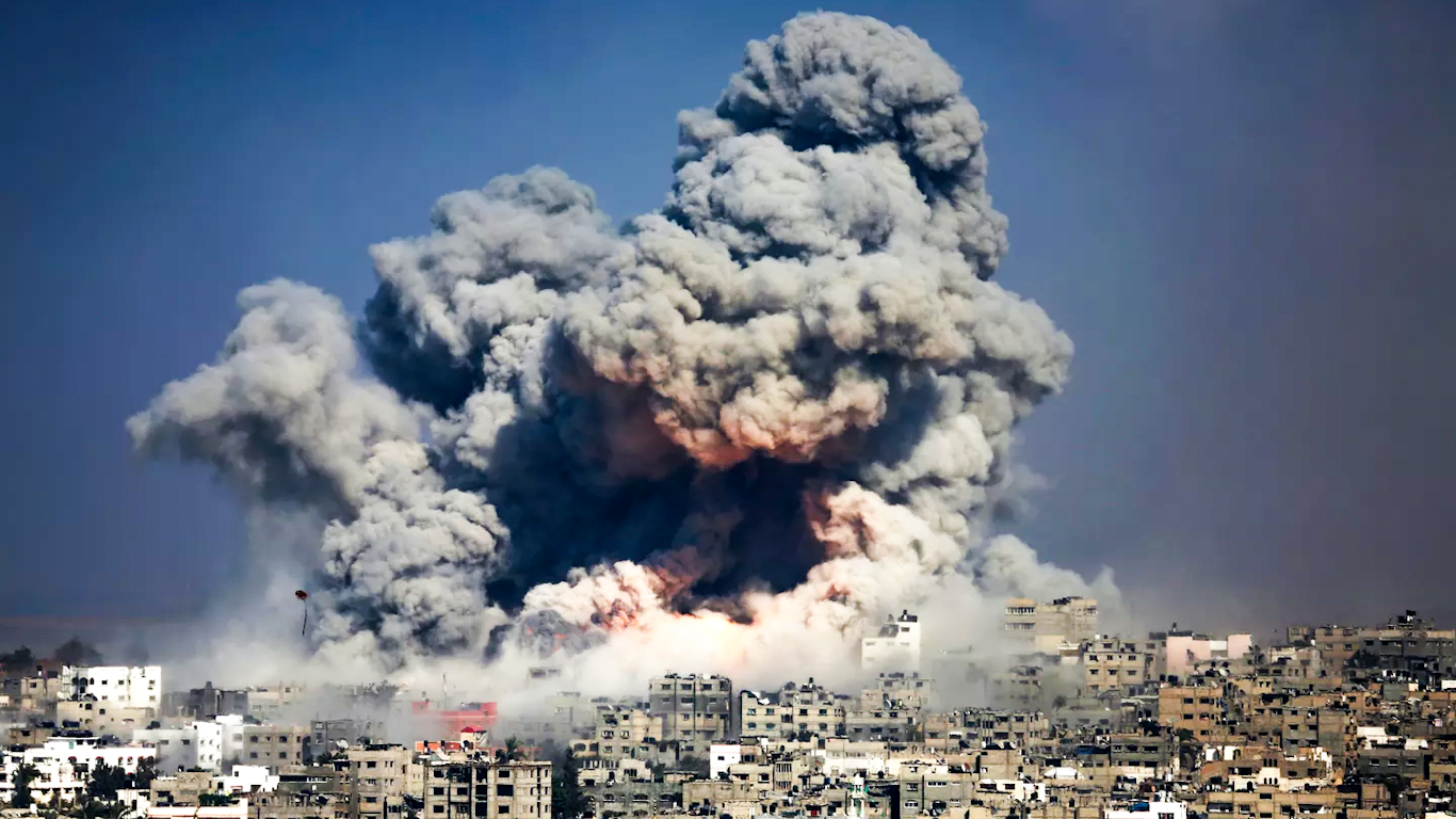 Smoke and fire engulf Gaza City following an Israeli airstrike on the densely populated urban area. Photo: Hatem Moussa/AP.