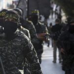 Members of the Al-Quds Brigades, the military wing of the Palestinian Resistance, march with their weapons to show loyalty to the new elected leader al-Nakhalah, during a rally in Gaza, October 4 2018. Photo: Adel Hana/AP/File photo.