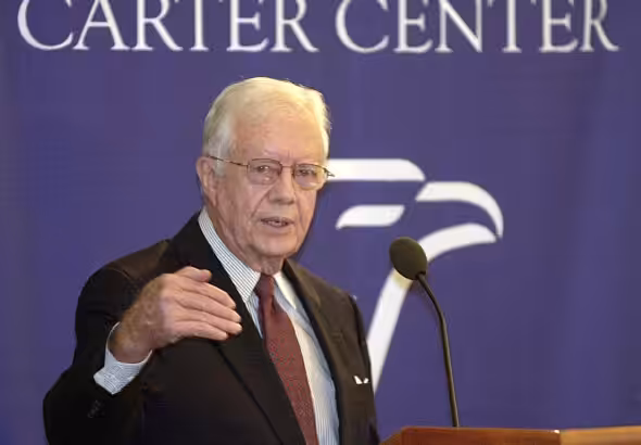 Former president of the US empire and head of the Carter Center, Jimmy Carter, pictured during a conference with a banner in the background reading "Carter Center." Photo: Reuters/File photo.