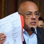 Jorge Rodríguez showing the agreement signed in Barbados last month. Photo: Gaby Oraa/Bloomberg.