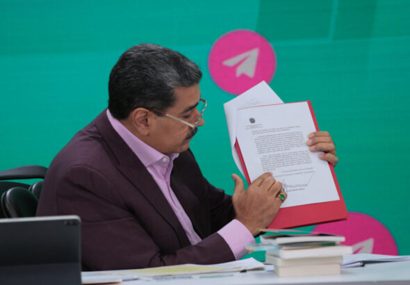 Venezuelan President Nicolas Maduro shows the letter he sent to United Nations demanding rectification of the Essequibo territory dispute during his television program Con Maduro+ on Monday, November 13, 2023. Photo: Venezuela Presidential Press.