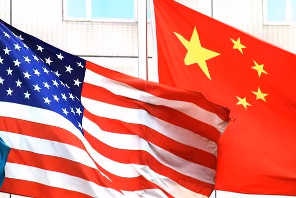 The flags of the US and the People's Republic of China fly. Photo: Times Asi/Flickr.