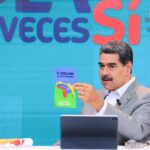 Venezuelan President Nicolás Maduro holds a pamphlet which reads "El Esequibo es de Venezuela," meaning "The Essequibo is Venezuela's."