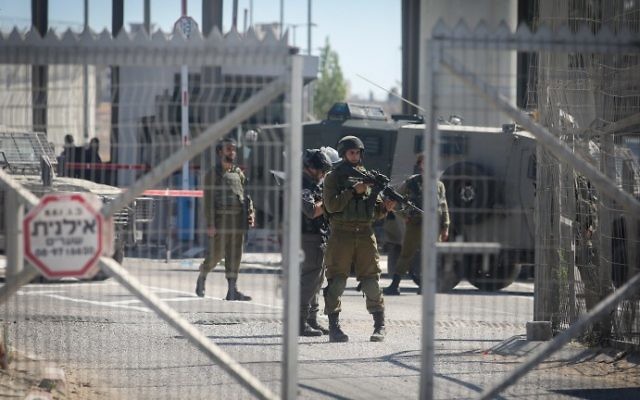 Israeli occupation forces at the Qalandiya Checkpoint near Ramallah on July 26, 2016. Photo: WAFA.
