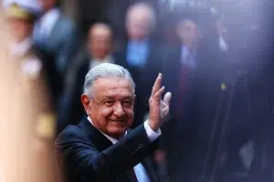 Andres Manuel Lopez Obrador, President of Mexico waves during the signing of a memorandum of understanding Between Mexico and Canada as part of the '2023 North American Leaders' Summit at Palacio Nacional on January 11, 2023 in Mexico City, Mexico. Photo: Manuel Velasquez/Getty Images.