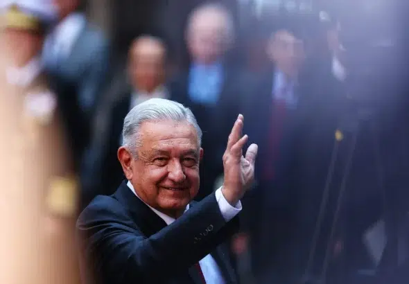 Andres Manuel Lopez Obrador, President of Mexico waves during the signing of a memorandum of understanding Between Mexico and Canada as part of the '2023 North American Leaders' Summit at Palacio Nacional on January 11, 2023 in Mexico City, Mexico. Photo: Manuel Velasquez/Getty Images.