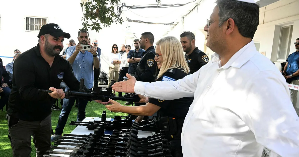 Israeli National Security Minister Itamar Ben-Gvir at the inauguration of a new civilian guard unit, handing out M5 automatic assault rifles, October 27, 2023. Photo: Ilia Yefimovich/Getty Images.