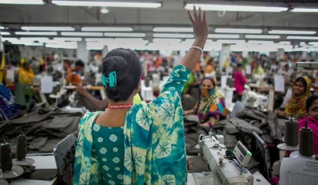Pushpa Rani Shaha, gives a victory wave to fellow garment workers. Photo: ILO Asia Pacific /Flickr.