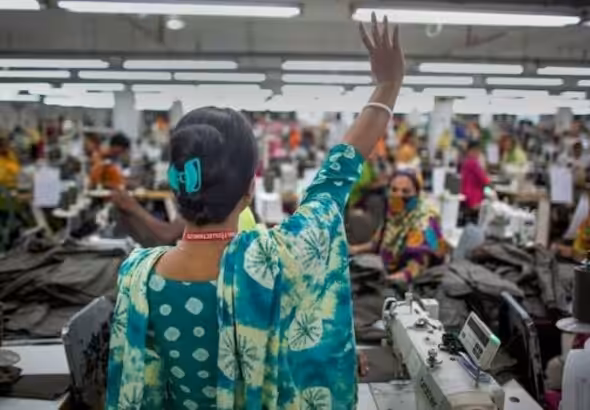 Pushpa Rani Shaha, gives a victory wave to fellow garment workers. Photo: ILO Asia Pacific /Flickr.