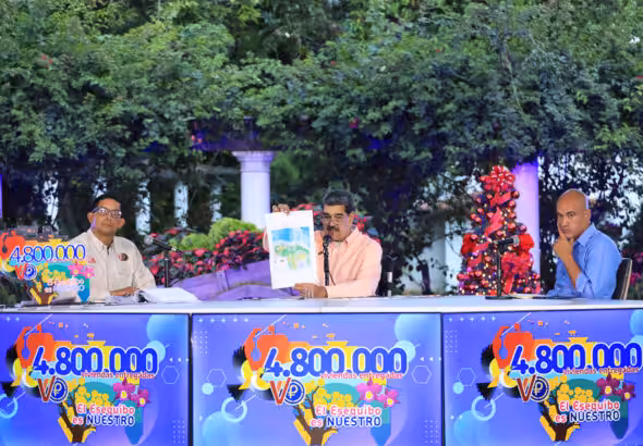 Venezuelan President Nicolás Maduro shows the new official map of Venezuela incorporating the Guayana Esequiba state, at a ceremony of delivery of house number 4.8 million built by the Venezuelan government for the people. Photo: Presidential Press.