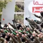 Hezbollah fighters salute at a parade. Photo: Al-Akbar/Haitham al-Mousawi