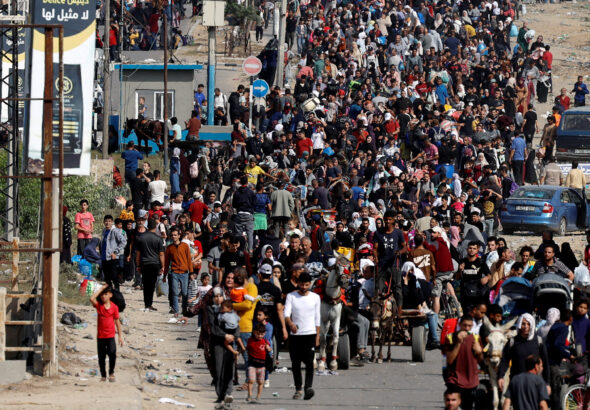 Palestinians fleeing north Gaza walk towards the south, in the central Gaza Strip, November 9. Photo: Mohammed Salem/Reuters.