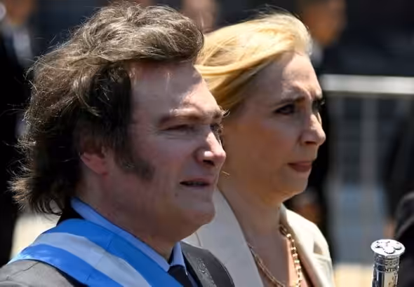 Javier Milei (left) and his sister Karina arrive at the government house in Buenos Aires, Argentina, December 10, 2023. Photo: Julian Bongiovanni/AP.