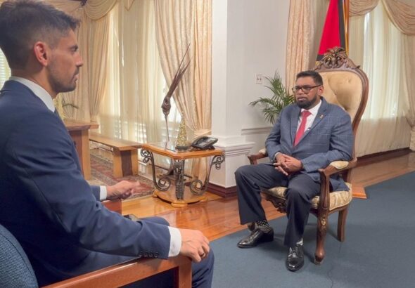 Leandro Prazeres, BBC Brazil journalist, interviewing the president of Guyana, Irfaan Ali. Photo: BBC.