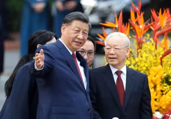 Xi Jinping, general secretary of the Communist Party of China Central Committee and Chinese president, attends a welcome ceremony held by Nguyen Phu Trong, general secretary of the Communist Party of Vietnam Central Committee, in front of the Presidential Palace in Hanoi, capital of Vietnam. Photo: Wang Zhuangfei/China Daily.