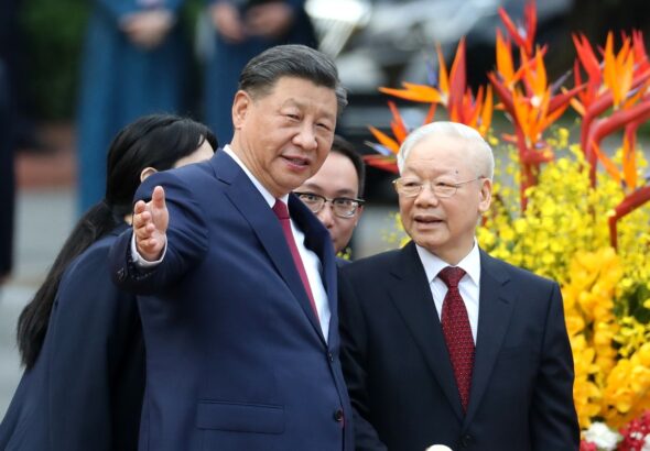 Xi Jinping, general secretary of the Communist Party of China Central Committee and Chinese president, attends a welcome ceremony held by Nguyen Phu Trong, general secretary of the Communist Party of Vietnam Central Committee, in front of the Presidential Palace in Hanoi, capital of Vietnam. Photo: Wang Zhuangfei/China Daily.